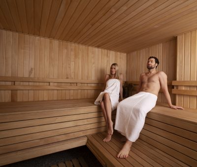 close-up-couple-relaxing-sauna